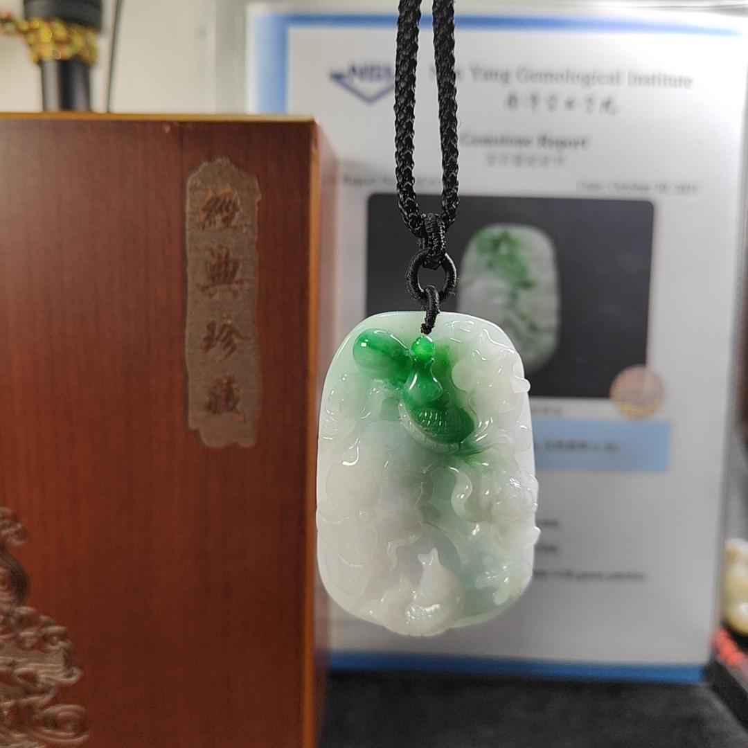 Carved with lotus fish Natural Type A Jadeite Pendant with Gemstone report from NGI - Weight 240.59 grams Measurement: 54.17 * 36.35 * 13.36 mm - Translucent with the Specify Gravity at 3.33 , Near white to faint green with green patches (pendant145) Yi Pin Qian