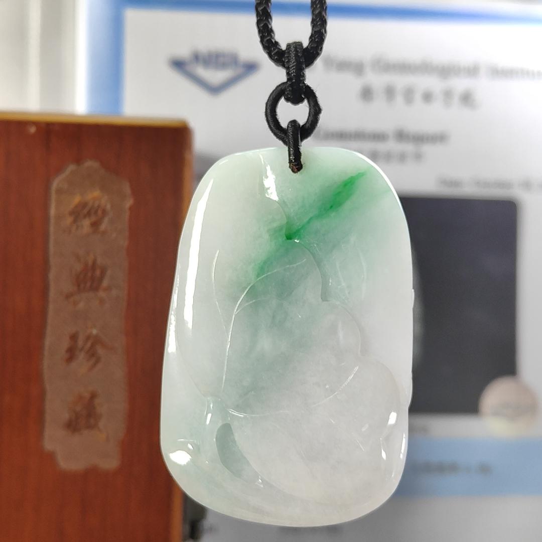 Carved with lotus fish Natural Type A Jadeite Pendant with Gemstone report from NGI - Weight 240.59 grams Measurement: 54.17 * 36.35 * 13.36 mm - Translucent with the Specify Gravity at 3.33 , Near white to faint green with green patches (pendant145) Yi Pin Qian