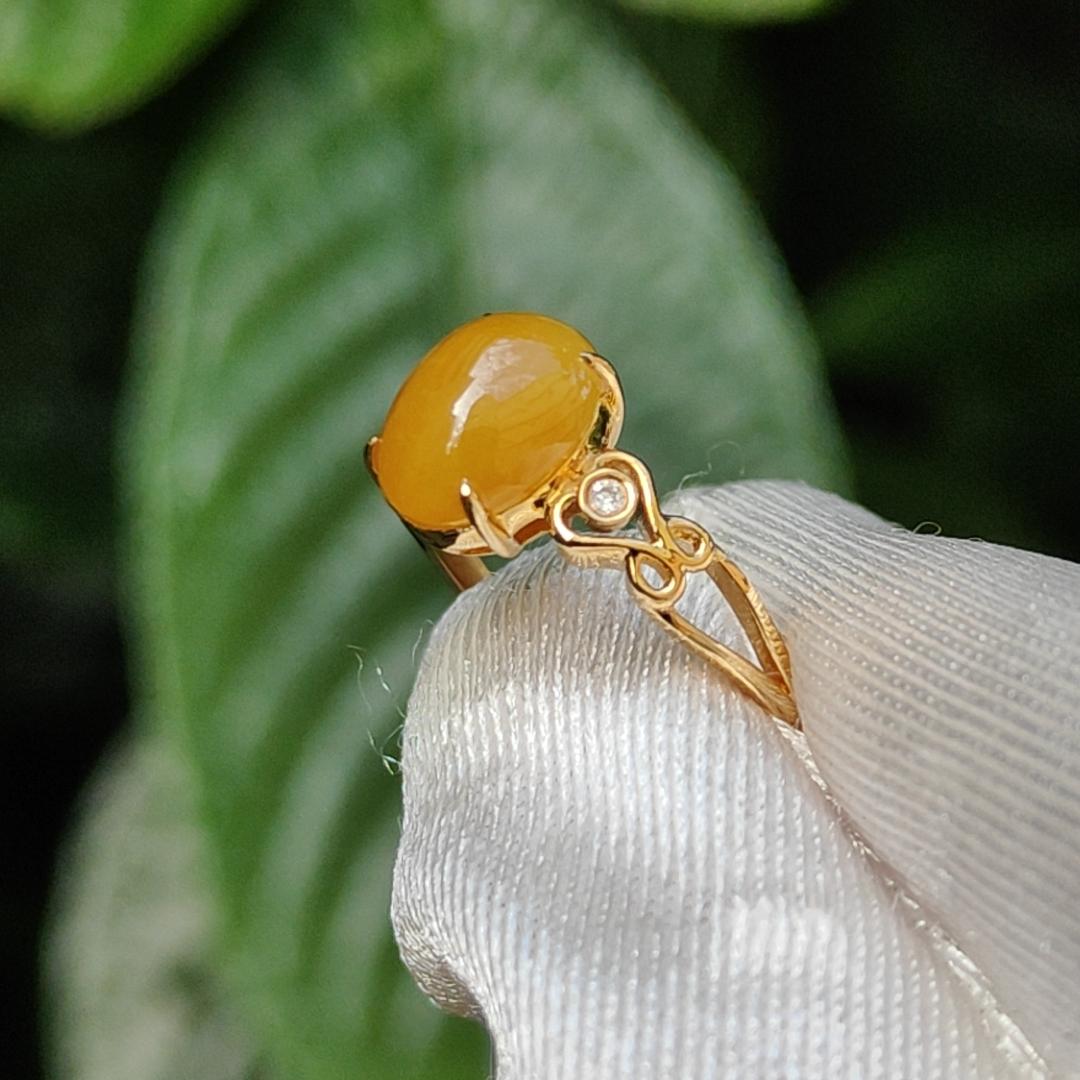 Yellow with a bit reddish Natural Type A Jadeite Jade Cabochon 8.6 * 7 * 3.6 mm set on 18k Gold as Ring adding 2 diamonds with certificate weigh 2.08 grams, finger size 16.8 mm (18kring13) Yi Pin Qian