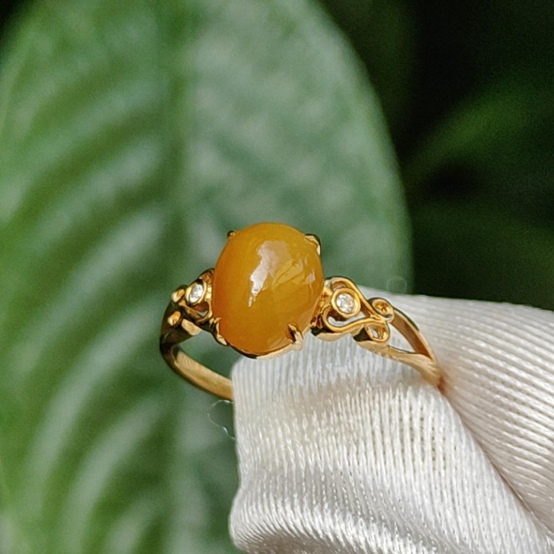 Yellow with a bit reddish Natural Type A Jadeite Jade Cabochon 8.6 * 7 * 3.6 mm set on 18k Gold as Ring adding 2 diamonds with certificate weigh 2.08 grams, finger size 16.8 mm (18kring13) Yi Pin Qian