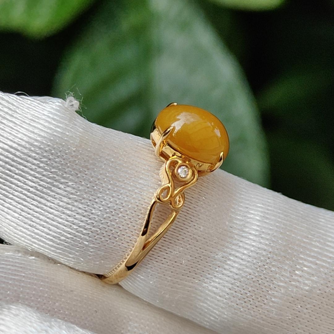 Yellow with a bit reddish Natural Type A Jadeite Jade Cabochon 8.6 * 7 * 3.6 mm set on 18k Gold as Ring adding 2 diamonds with certificate weigh 2.08 grams, finger size 16.8 mm (18kring13) Yi Pin Qian