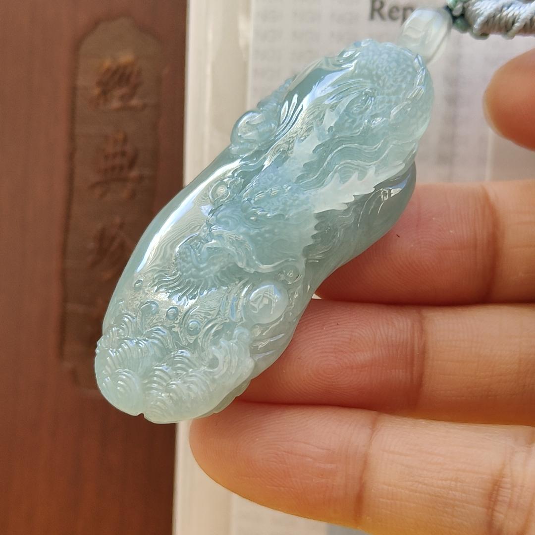Natural Type A Jadeite Jewellery Pendant carved with dragon weighs at 30.06 grams , 50.32 * 23.30 * 12.93 mm - with Gemstone report from NGI - Very Good Translucency with faint greenish blue (pendant140) Yi Pin Qian