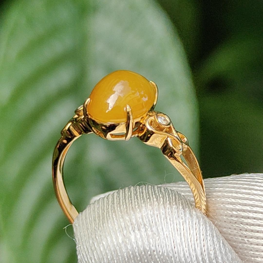 Yellow with a bit reddish Natural Type A Jadeite Jade Cabochon 8.6 * 7 * 3.6 mm set on 18k Gold as Ring adding 2 diamonds with certificate weigh 2.08 grams, finger size 16.8 mm (18kring13) Yi Pin Qian