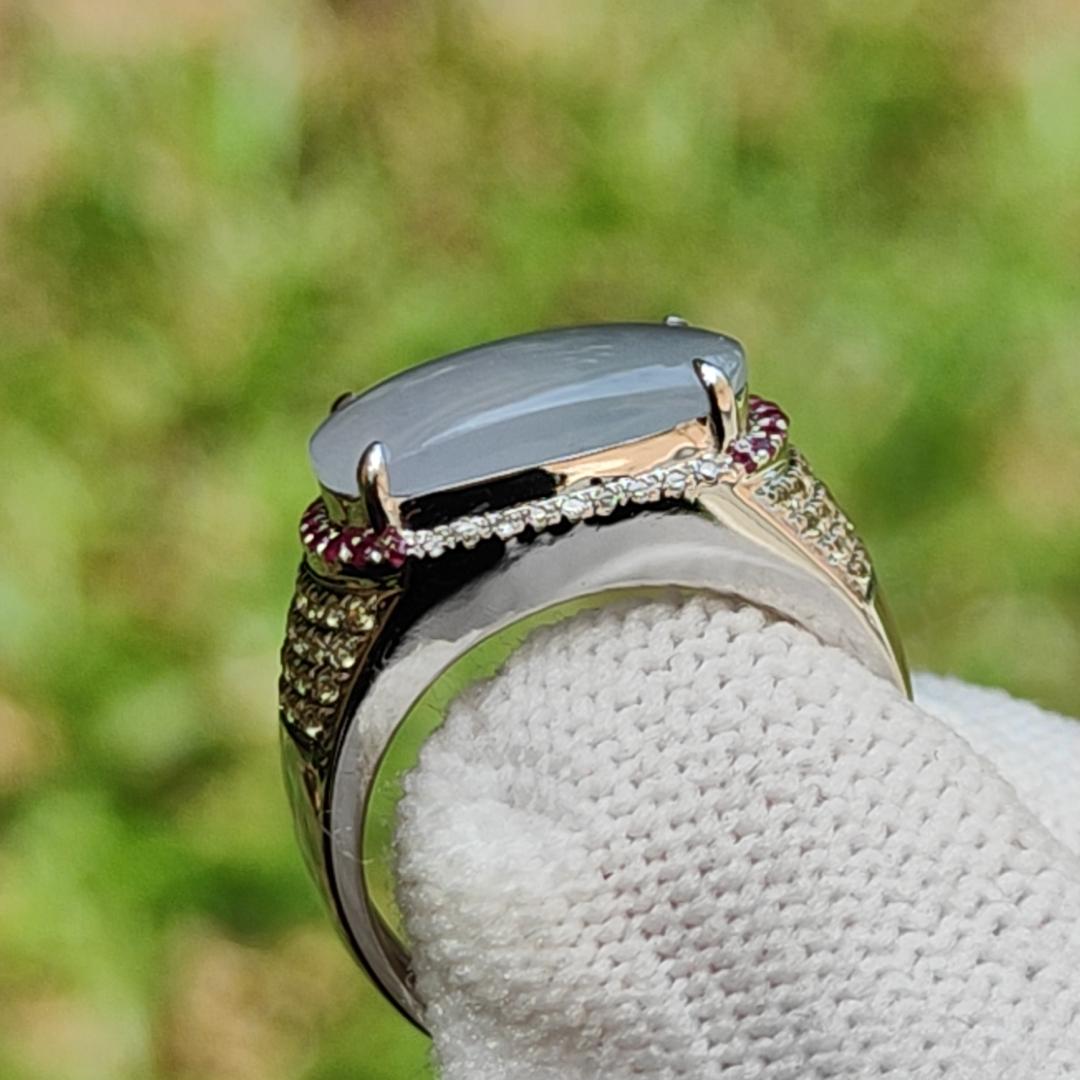 Premium Quality Light Lavender Natural Type A Jadeite Jade crafted as Cabochon 12.8 * 6.7 * 2.8mm, set on 18k Gold with Ruby and Diamonds as Ring, Finger Size 15.5 mm, certificate weigh 3.22 grams (18kring23) Yi Pin Qian