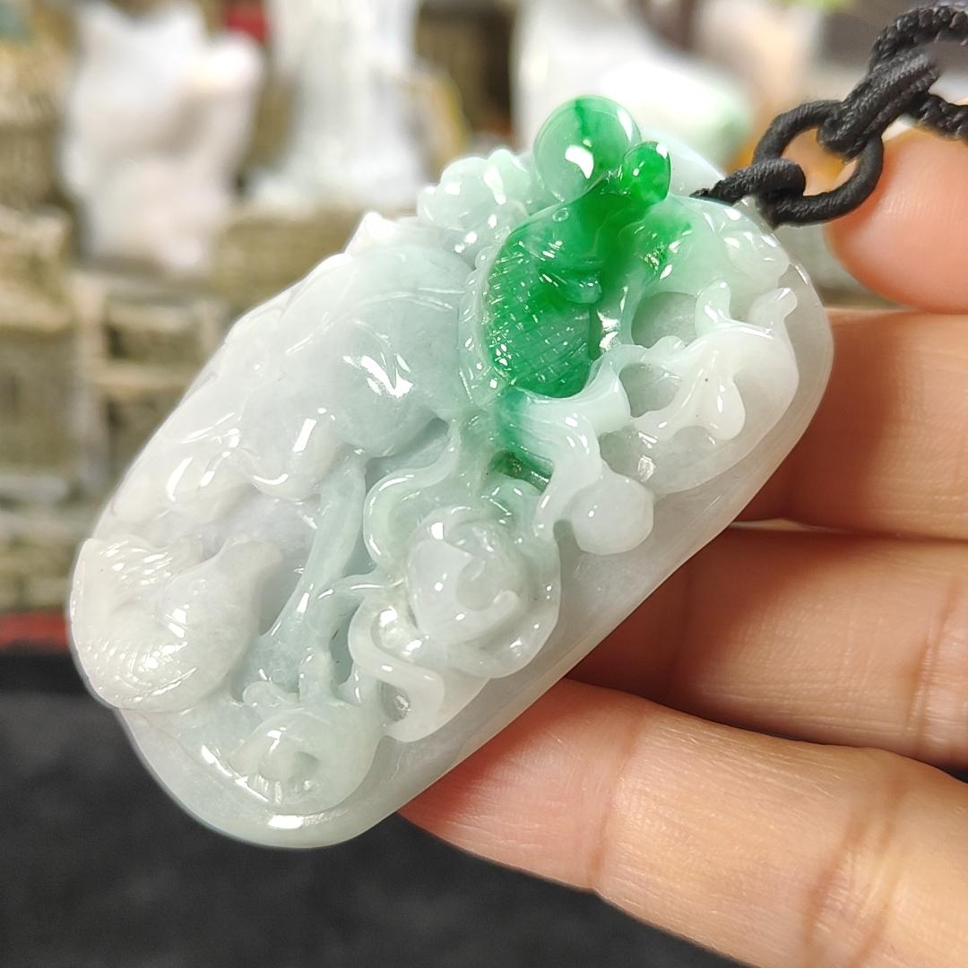Carved with lotus fish Natural Type A Jadeite Pendant with Gemstone report from NGI - Weight 240.59 grams Measurement: 54.17 * 36.35 * 13.36 mm - Translucent with the Specify Gravity at 3.33 , Near white to faint green with green patches (pendant145) Yi Pin Qian