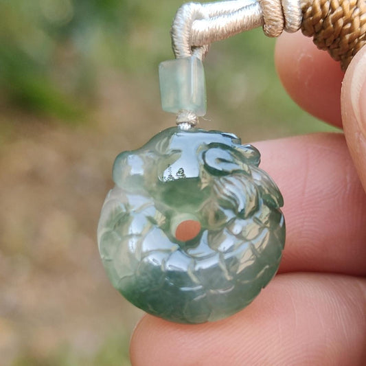 #Sold - High Quality Green with Green Patches Natural Type A Jadeite Jade crafted with shape of Donut with Baby Dragon as Pendant, QIC approved labs certificate weigh 4.11 grams, measurement 17.2 * 16.3 * 5.1 mm (pendant242)