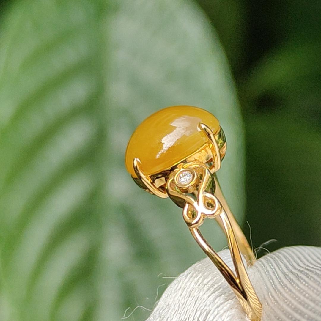 Yellow with a bit reddish Natural Type A Jadeite Jade Cabochon 8.6 * 7 * 3.6 mm set on 18k Gold as Ring adding 2 diamonds with certificate weigh 2.08 grams, finger size 16.8 mm (18kring13) Yi Pin Qian