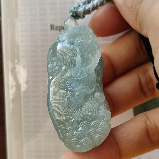 Natural Type A Jadeite Jewellery Pendant carved with dragon weighs at 30.06 grams , 50.32 * 23.30 * 12.93 mm - with Gemstone report from NGI - Very Good Translucency with faint greenish blue (pendant140) Yi Pin Qian