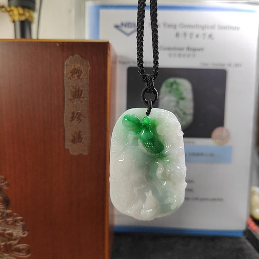 Carved with lotus fish Natural Type A Jadeite Pendant with Gemstone report from NGI - Weight 240.59 grams Measurement: 54.17 * 36.35 * 13.36 mm - Translucent with the Specify Gravity at 3.33 , Near white to faint green with green patches (pendant145) Yi Pin Qian