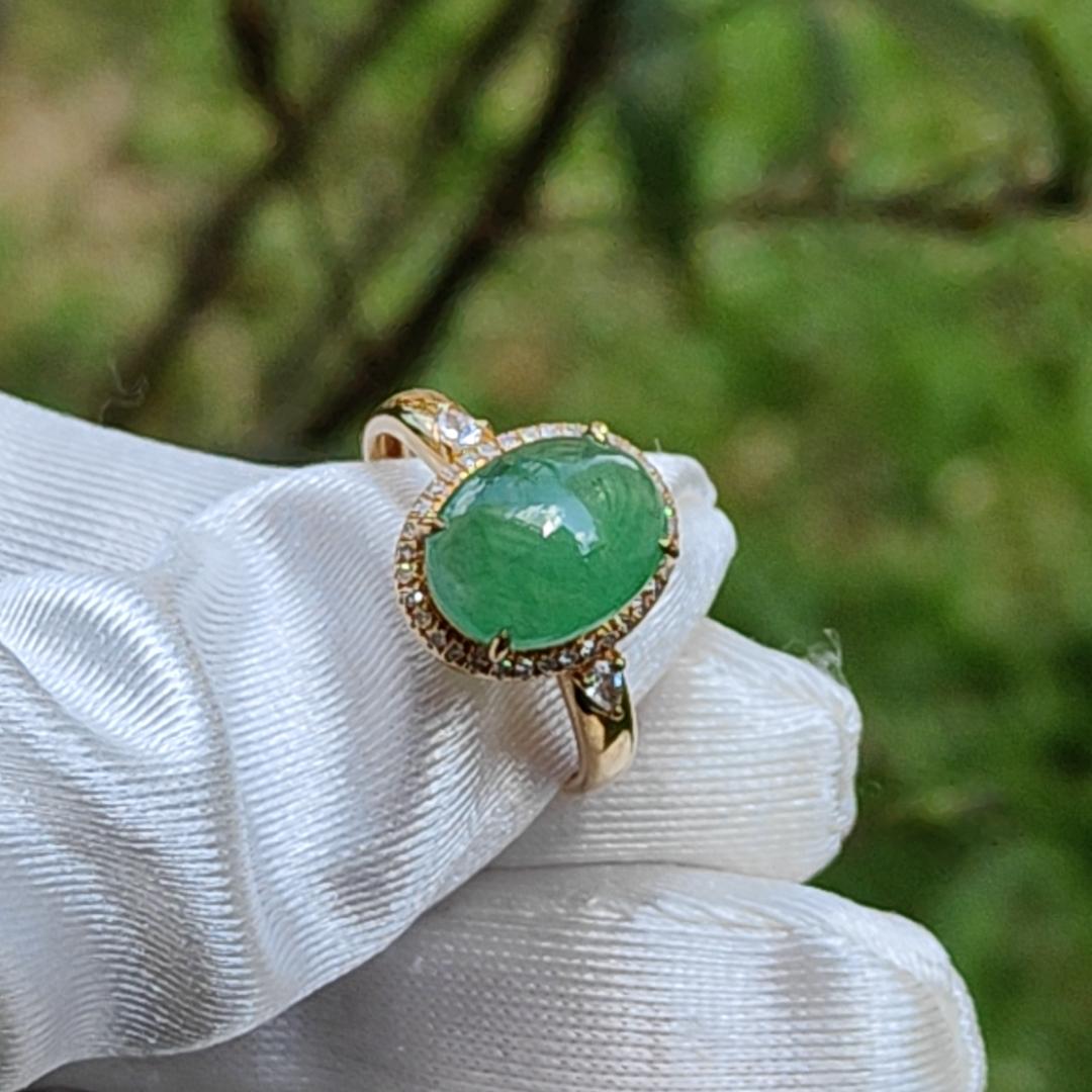 18K Gold weigh 2 grams, Setting with Natural Type A Jadeite Green Cabochon size 10.7 * 8.3 * 3.8 mm with 35 * 0.003 and 2 * 0.03 pear cut diamonds, certificate included weigh 2.65 grams, Finger ring size 17.3 mm, Yi Pin Qian