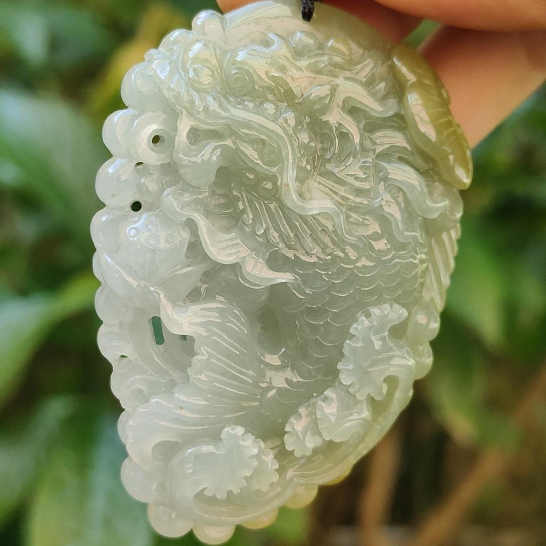 Tea Green Yellow Natural Type A Jadeite Pendant Carved as Dragon Head Fish Body meaning Prosperity, wealth and happiness with certificate weighs 49.67 grams, 62.60 * 43.50 * 12.10 mm (pendant93) Yi Pin Qian