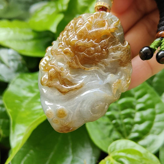 Very Rare Golden Yellow Old Mine Natural Type A Jadeite Jewellery Pendant with NGI report weighs at 423.86 grams , 62.47 * 46.16 * 22.95 mm Carved as dragon , Fine Translucent near colorless to faint greenish blue with patches of brown (pendant154) Yi Pin Qian
