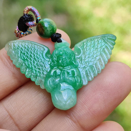 Green Jadeite carved as Angel (Front) and Cross (back) Natural Type A Jadeite pendant with NGI Gemstone report weight 6.33 gram , 35.39 * 23.76 * 5.61 mm with Translucent fine grain crystal aggregate granular and fibrous interlocking texture (pendant139) Yi Pin Qian