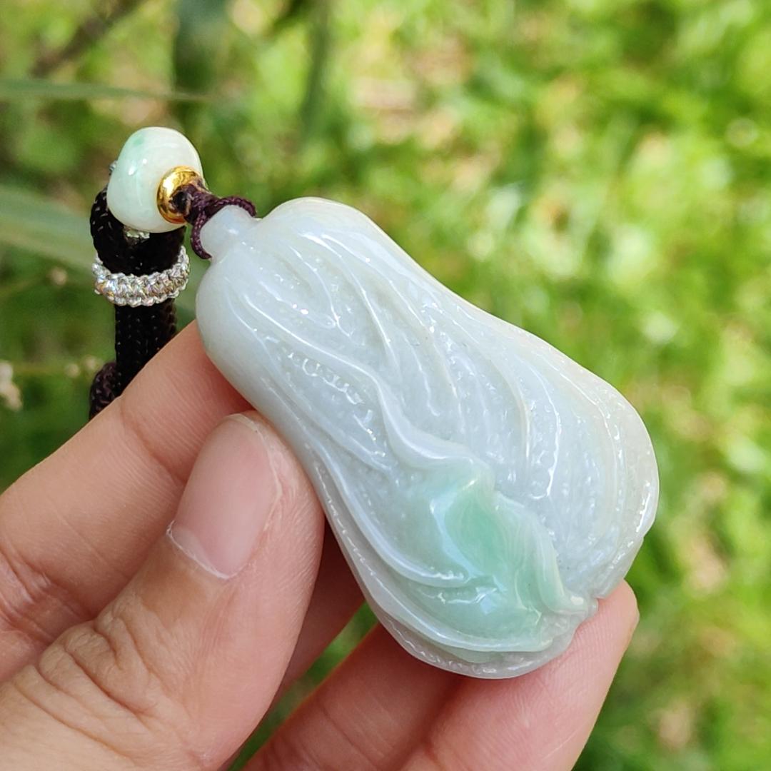 Crafted as Chinese cabbage with patches of light green Natural Type A Jadeite Pendant Necklace with QIC approved labs certificate weigh 31.92 grams, 46.8 * 27.3 * 18 mm, symbols of Boosts wealth, purity, and good weather, suitable for daily wear Yi Pin Qian