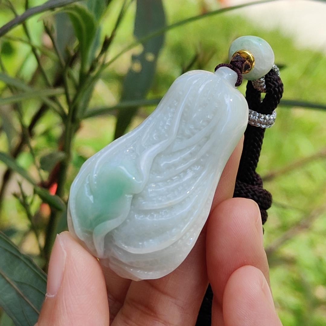 Crafted as Chinese cabbage with patches of light green Natural Type A Jadeite Pendant Necklace with QIC approved labs certificate weigh 31.92 grams, 46.8 * 27.3 * 18 mm, symbols of Boosts wealth, purity, and good weather, suitable for daily wear Yi Pin Qian