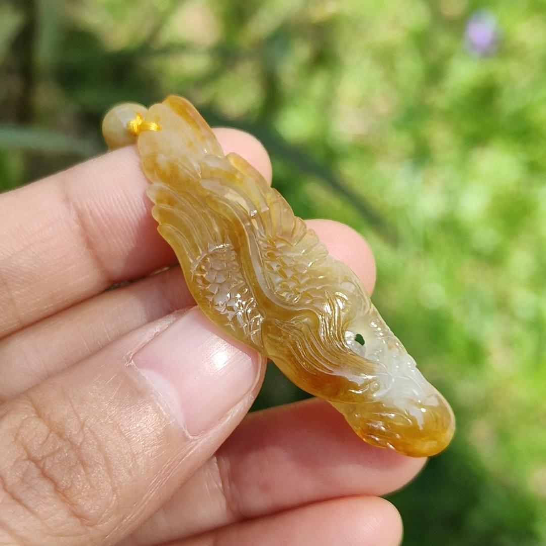 Yellow Natural Type A Jadeite crafted with Eagle and Chinese Coins symbols of Winner, Money and Luck, with QIC labs Approved certificate weigh 8.21 grams, 49.8 * 15.5 * 8.1 mm, very suitable for daily wear Yi Pin Qian