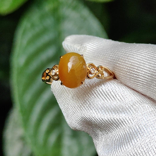 Yellow with a bit reddish Natural Type A Jadeite Jade Cabochon 8.6 * 7 * 3.6 mm set on 18k Gold as Ring adding 2 diamonds with certificate weigh 2.08 grams, finger size 16.8 mm (18kring13) Yi Pin Qian