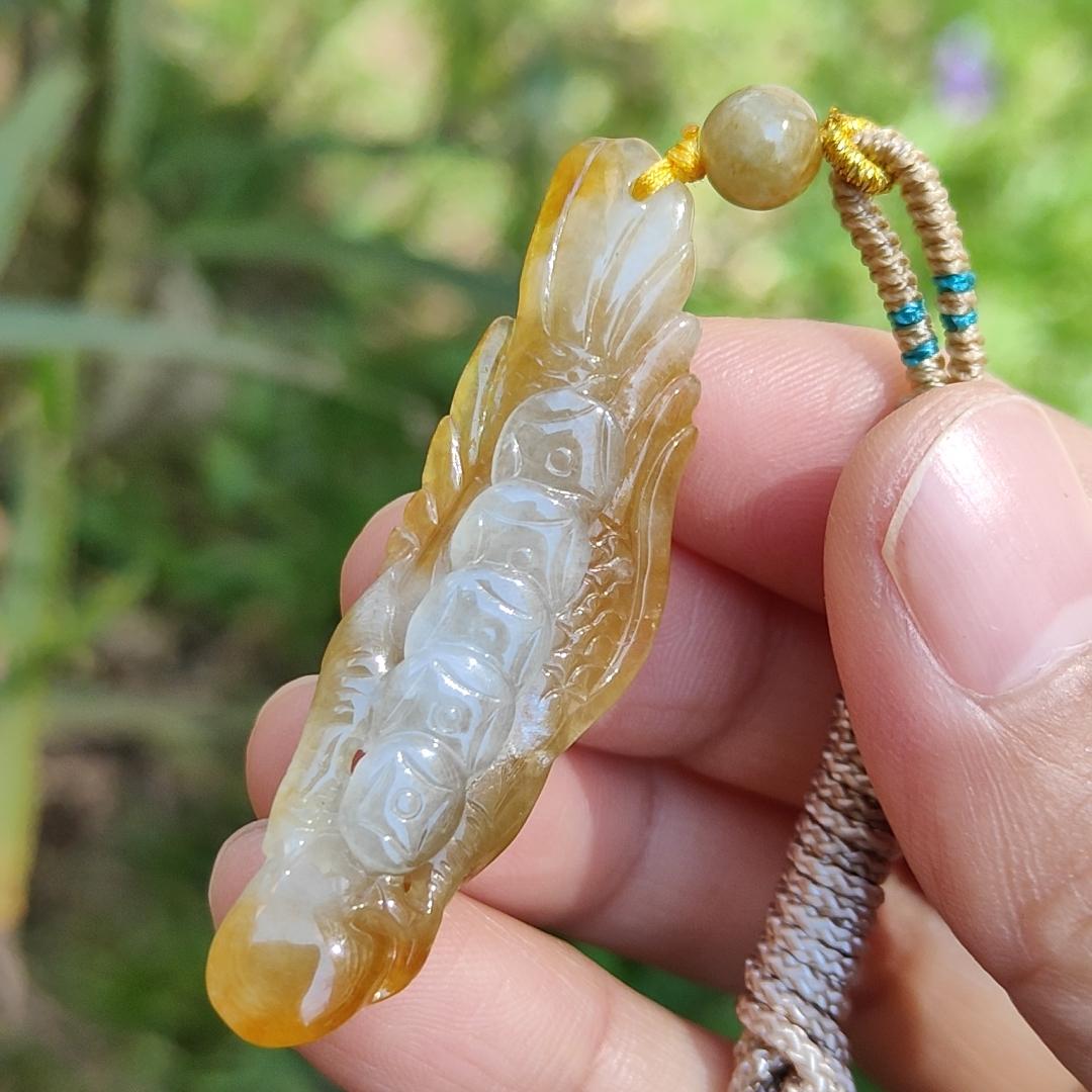 Yellow Natural Type A Jadeite crafted with Eagle and Chinese Coins symbols of Winner, Money and Luck, with QIC labs Approved certificate weigh 8.21 grams, 49.8 * 15.5 * 8.1 mm, very suitable for daily wear Yi Pin Qian