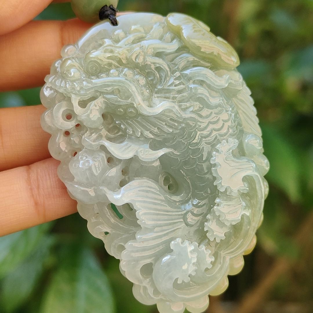 Tea Green Yellow Natural Type A Jadeite Pendant Carved as Dragon Head Fish Body meaning Prosperity, wealth and happiness with certificate weighs 49.67 grams, 62.60 * 43.50 * 12.10 mm (pendant93) Yi Pin Qian