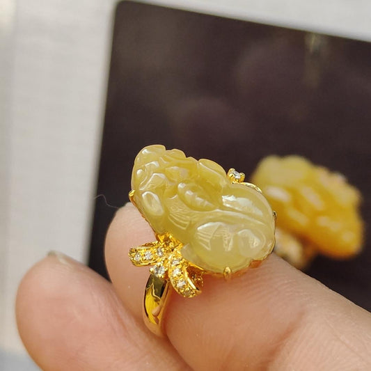 Yellow Pixiu Natural Type A Jadeite ring set with 18k Gold and diamonds with NGI Gemstone report weighs 2.89 grams, 16.10 * 9.36 * 3.81 mm (Internal Diameter Finger Size = 15.6mm) , 18k Gold tested using X-Ray fluorescence method (18kring9) Yi Pin Qian