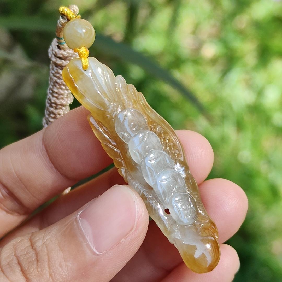 Yellow Natural Type A Jadeite crafted with Eagle and Chinese Coins symbols of Winner, Money and Luck, with QIC labs Approved certificate weigh 8.21 grams, 49.8 * 15.5 * 8.1 mm, very suitable for daily wear Yi Pin Qian