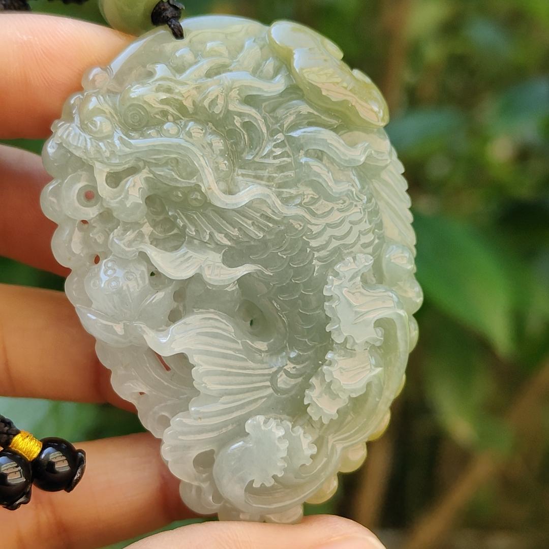 Tea Green Yellow Natural Type A Jadeite Pendant Carved as Dragon Head Fish Body meaning Prosperity, wealth and happiness with certificate weighs 49.67 grams, 62.60 * 43.50 * 12.10 mm (pendant93) Yi Pin Qian