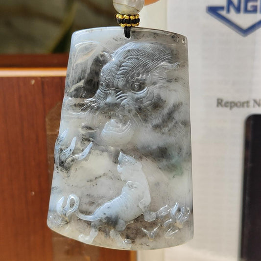 Very Unique Double Theme Natural Type A fine Jadeite pendant carved as Tiger [Front] , Landscape [Back] , with NGI Gemstone report weighs 30.33grams , 54.29 * 37.61 * 5.73 mm , near colorless with patches of grey pendant for your daily wear (pendant158) Yi Pin Qian