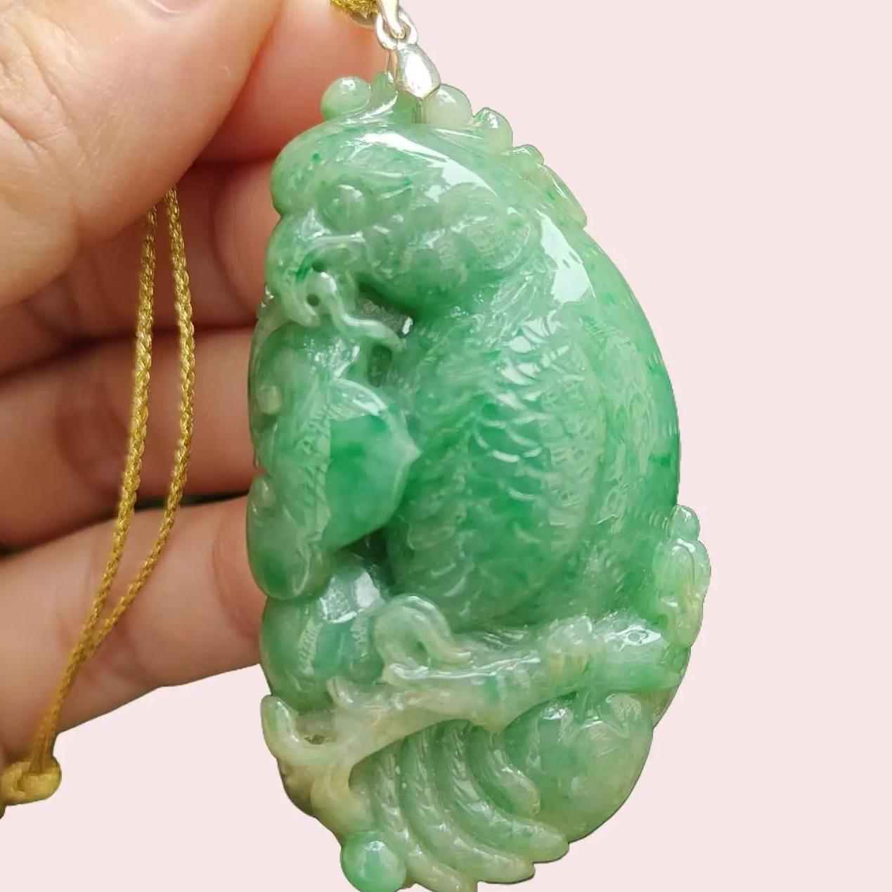 Green Natural Type A Jadeite Jade crafted with Parrot with Ruyi and Coin as Pendant, ceritificate weighs 22.55 grams, measurement 54.6 * 30 * 9.2 mm (pendant332) Yi Pin Qian Jadeites Jade Jewelry ~Your Precious Quintessential ~ Singapore