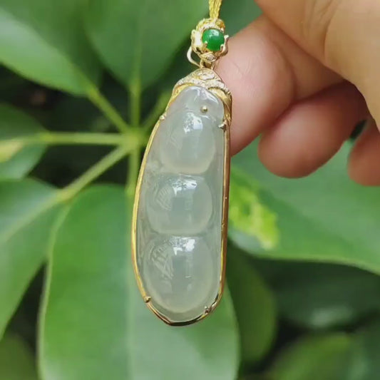 High Quality Good Translucent Light Green Hue Natural Type A Jadeite Jade Crafted as Bean, set on 18k gold as Pendant Necklace certificate weighs 6.88 grams (18kp68)