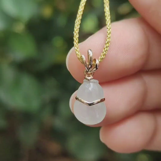 High Quality SG New Arrival crafted as small Gourd on Natural Type A Jadeite Jade set with 18k gold as pendant, certificate weighs 1.01 grams, measurement 18.9 * 8.3 * 4.3 mm (18kp75)